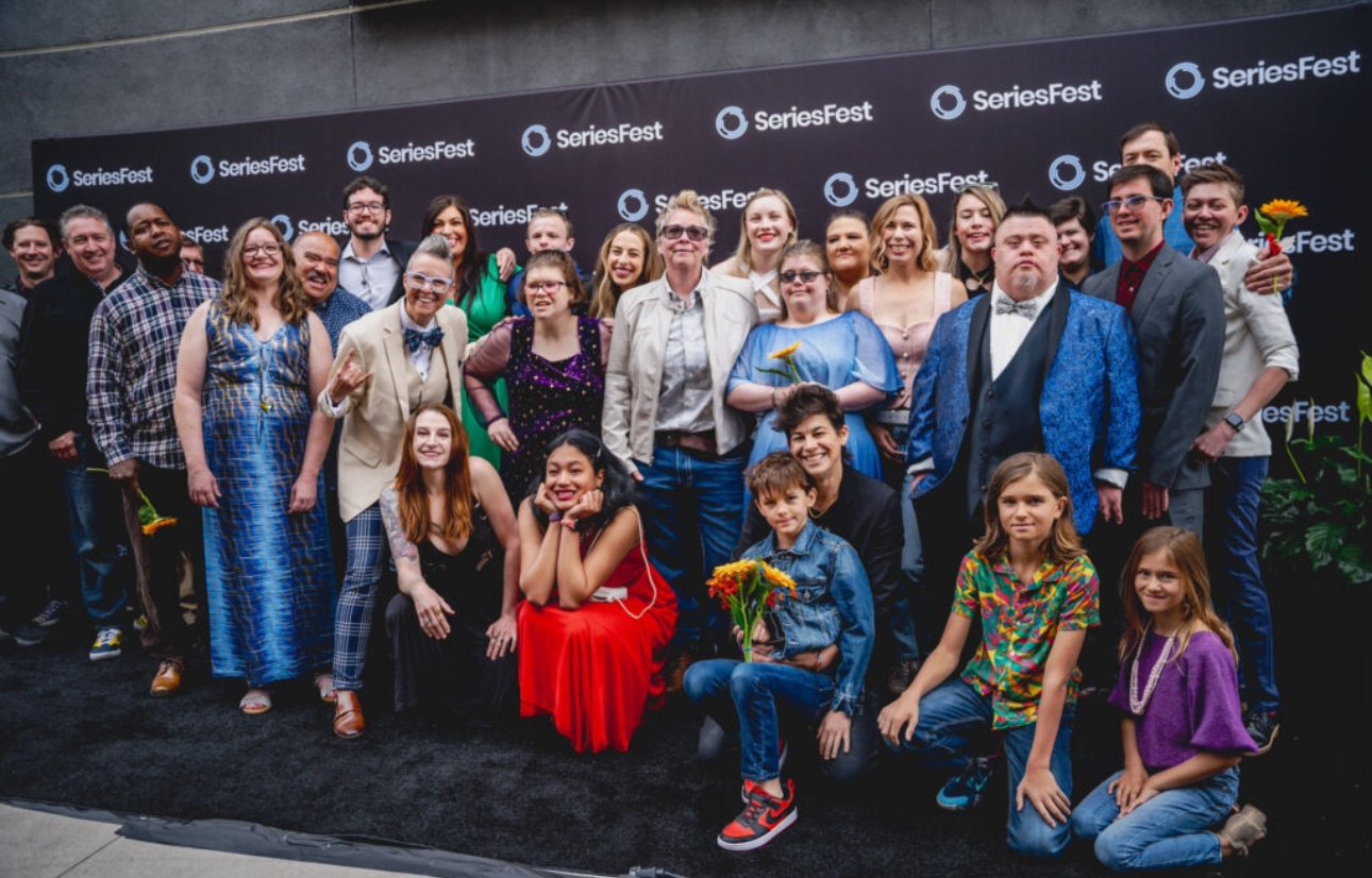The Brewability team and their families on a red carpet in front of a SeriesFest backdrop, around thirty people dressed up and smiling.